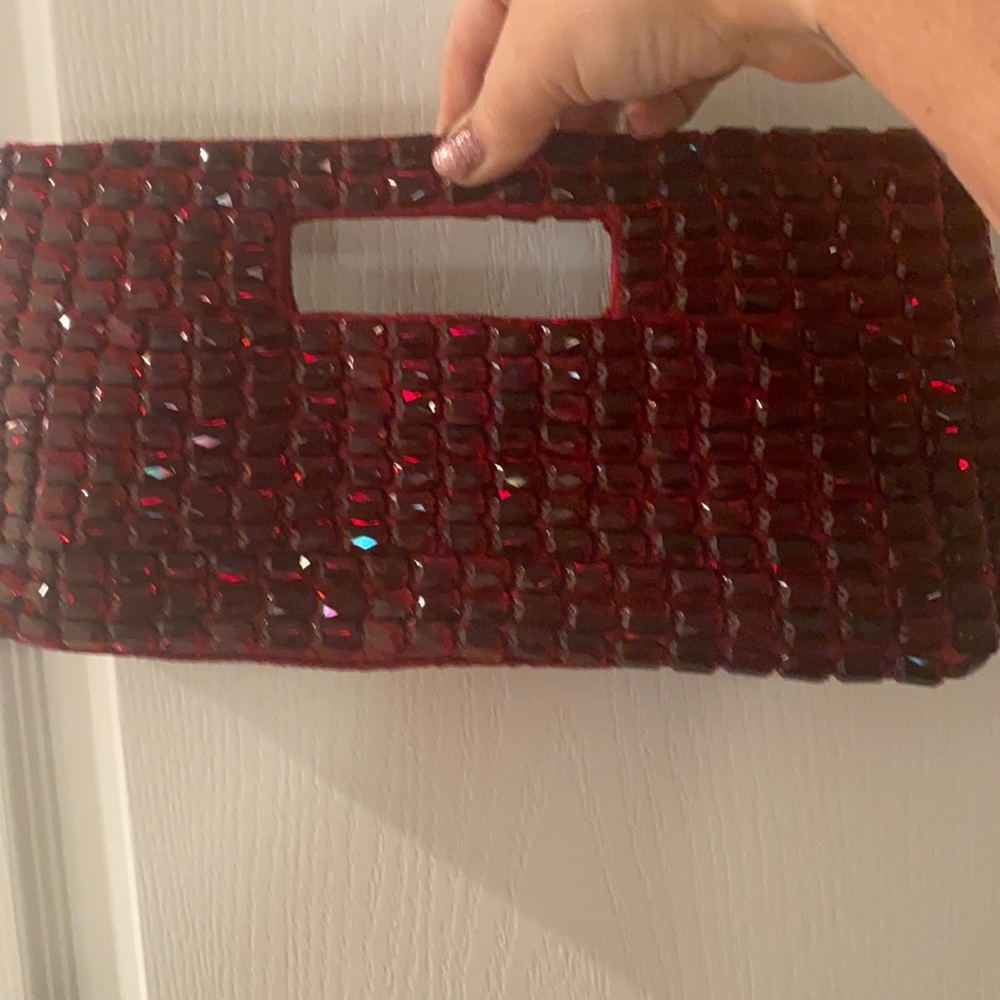 Dark red gem covered clutch